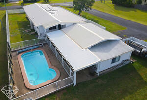 Live the ultimate Queensland lifestyle in this stunning 3 bedroom house with a pool, entertainment area, and rumpus room in Burnett Heads image 3