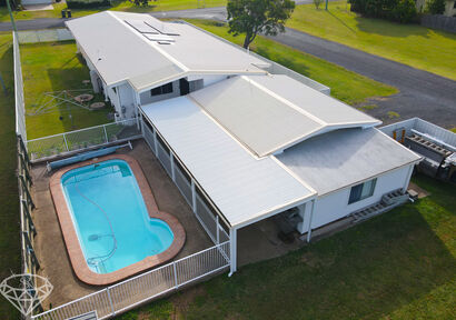Live the ultimate Queensland lifestyle in this stunning 3 bedroom house with a pool, entertainment area, and rumpus room in Burnett Heads image 3